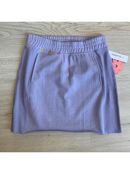 Pocket skirt with raw edge and rib inset