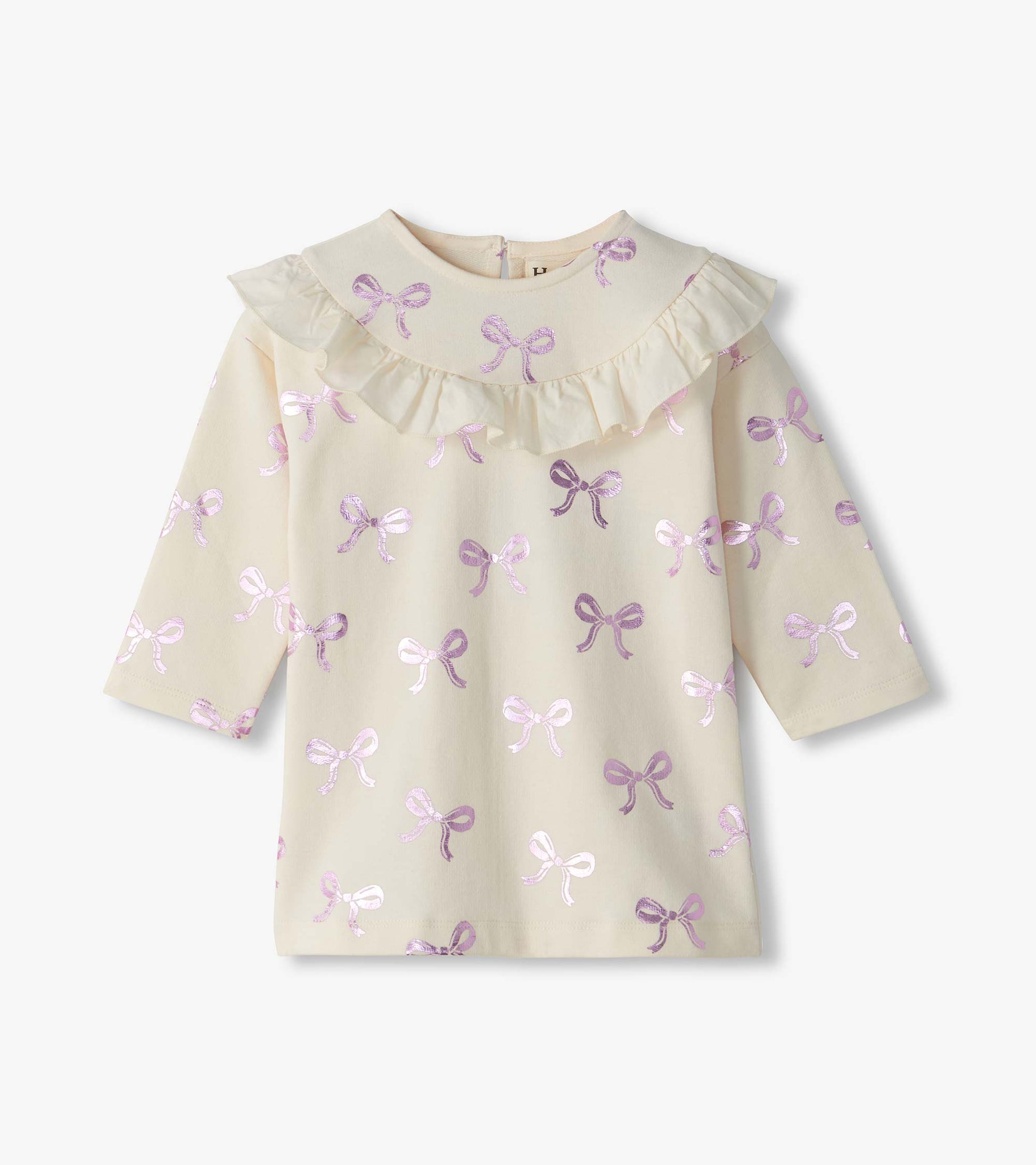 off white dress with pink bow patterns on a white background